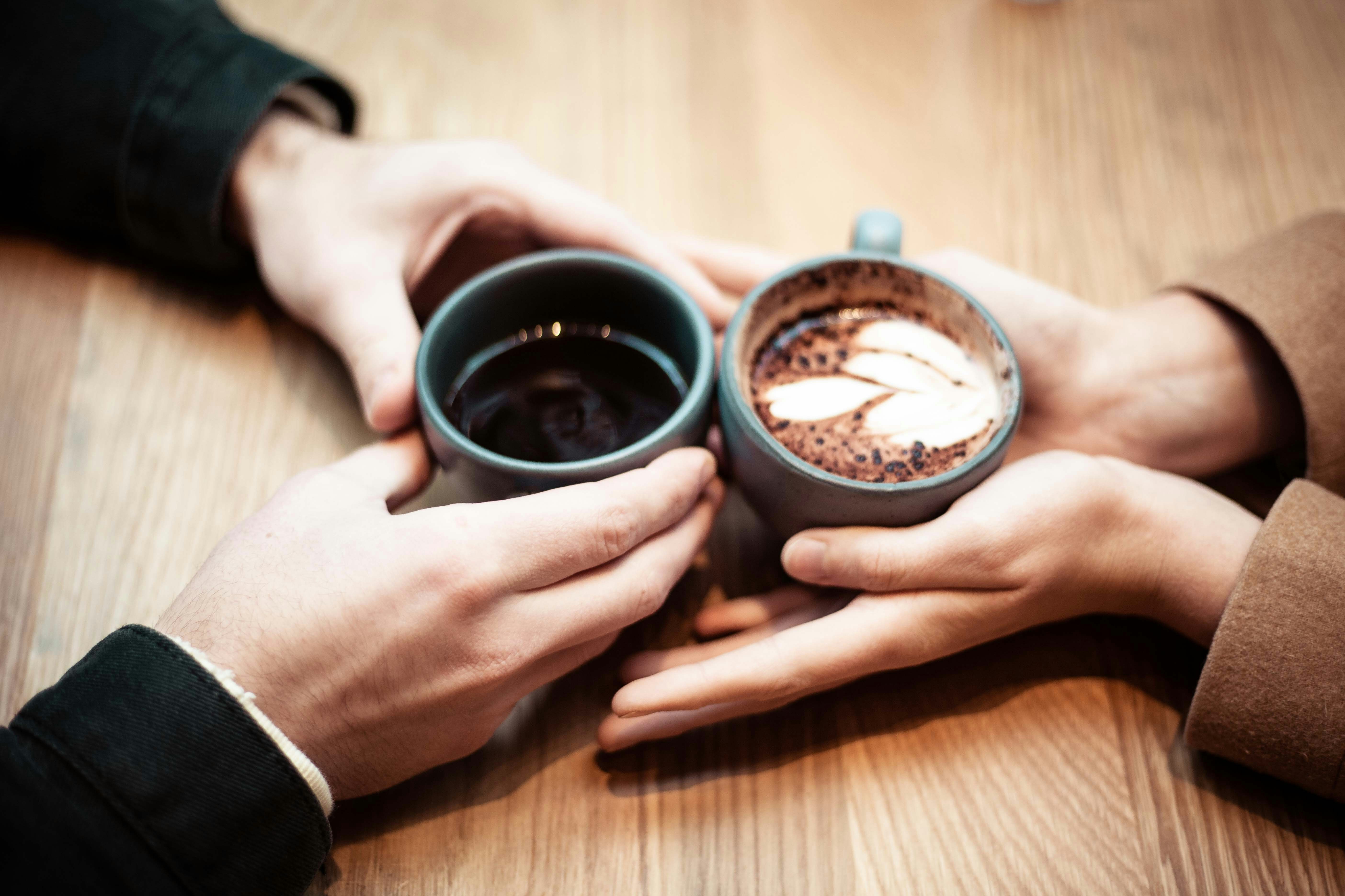 Couple's hands holding a love note